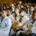 Profissionais de saúde do programa Mais Médicos assistindo a uma palestra