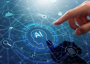 Imagem ilustrativa da inteligência artificial com uma mão tocando um ícone de IA, simbolizando o avanço da tecnologia e suas aplicações em cursos lucrativos.