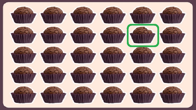 Desafio visual com brigadeiros em forminhas roxas, dispostos em uma grade com um brigadeiro diferente em algum lugar.