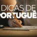 Pessoa escrevendo dicas sobre a língua portuguesa com lápis em caderno.