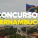 Bandeira de Pernambuco e do Brasil com texto Concurso Pernambuco em destaque sobre imagem da cidade.