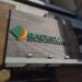 Fachada do prédio do Badesul com placa e logo em destaque