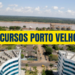 Vista aérea de Porto Velho com prédios modernos, vegetação tropical e Rio Madeira ao fundo com silos de armazenamento